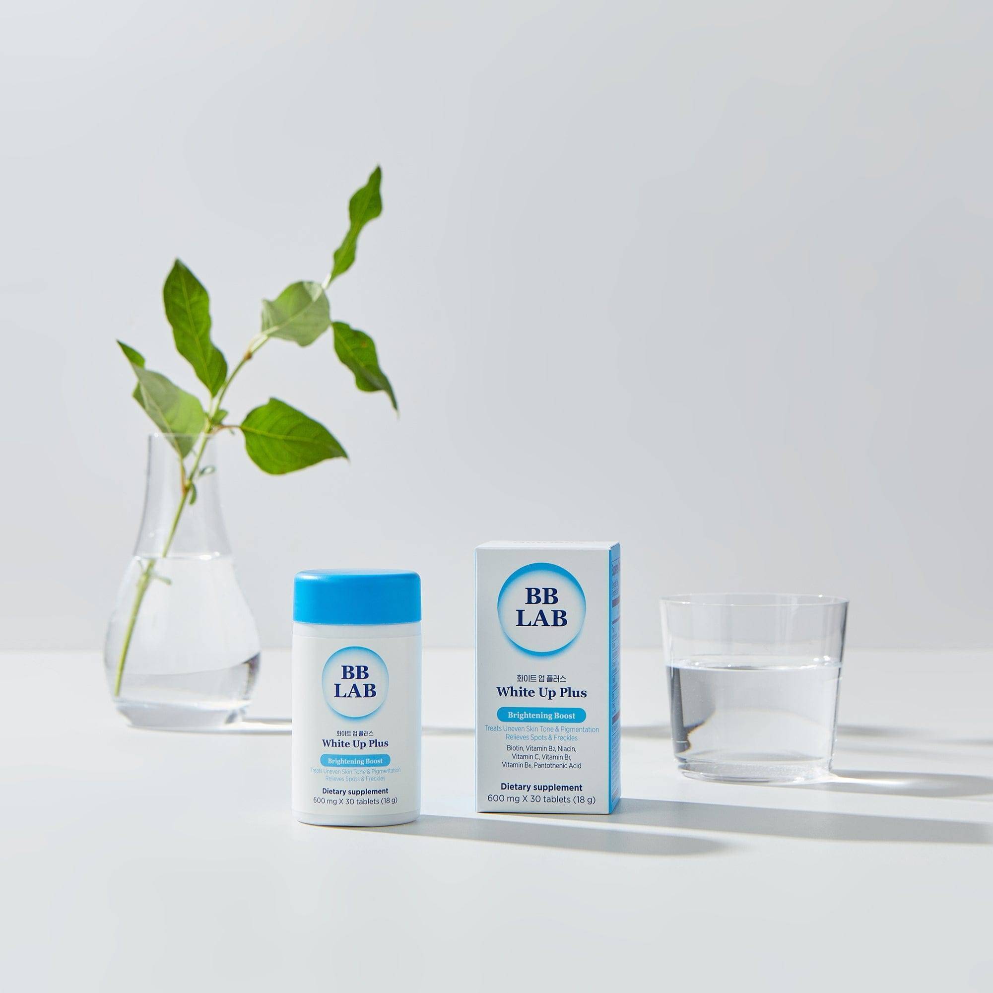 White Up Plus bottle and box with water