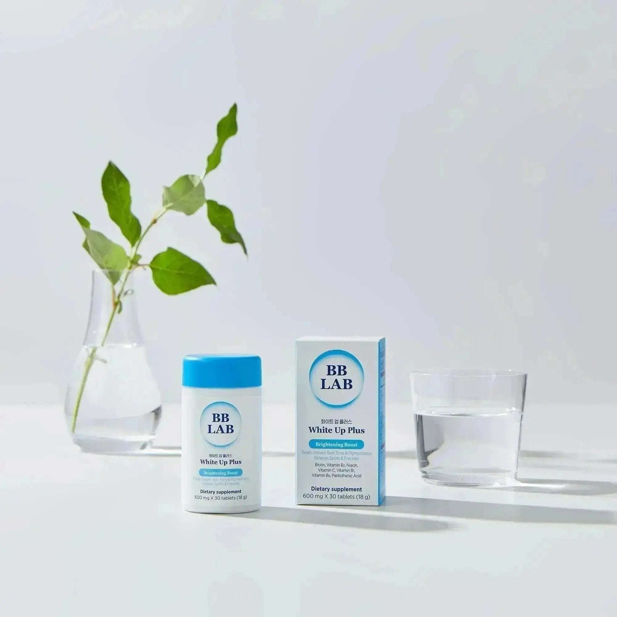 White Up Plus bottle and box with water